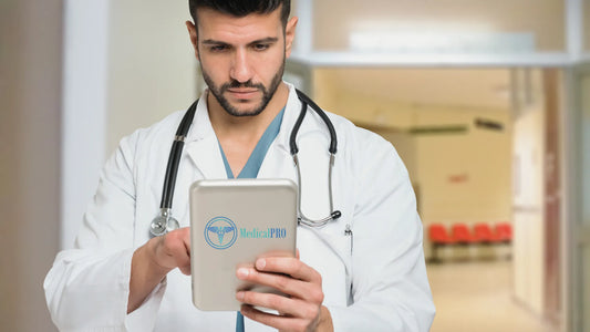 Doctor using clinic management software on a touchscreen tablet